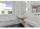 Modern bathroom with dual floating vanities, stylish mirrors, and sleek fixtures for a luxurious feel at 227 Woodsborough Pl, Raleigh, NC 27601