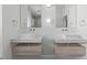 Modern bathroom with dual floating vanities, stylish mirrors, and sleek fixtures for a luxurious feel at 227 Woodsborough Pl, Raleigh, NC 27601