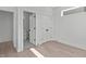 Clean bedroom features hardwood floors, ample closet space, and an ensuite bathroom at 227 Woodsborough Pl, Raleigh, NC 27601