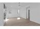 Bright bedroom with hardwood floors, a ceiling fan, natural light, and access to an outdoor balcony at 227 Woodsborough Pl, Raleigh, NC 27601