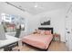 Chic bedroom with hardwood floors, modern decor, and ample natural light from the window at 227 Woodsborough Pl, Raleigh, NC 27601