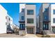 Modern townhouse exterior features clean lines, neutral tones, and a convenient attached garage at 227 Woodsborough Pl, Raleigh, NC 27601