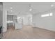 Open-concept living space with kitchen, and large windows at 227 Woodsborough Pl, Raleigh, NC 27601