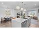 A modern living room and dining area featuring an open layout and stylish design at 227 Woodsborough Pl, Raleigh, NC 27601