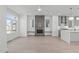 Spacious living room connecting kitchen with modern fireplace and hardwood floors at 227 Woodsborough Pl, Raleigh, NC 27601