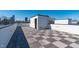 Rooftop deck overlooking the city, featuring custom wood tile and a modern, minimalist design at 227 Woodsborough Pl, Raleigh, NC 27601