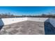 Expansive rooftop deck with custom wood tile and privacy fencing provides a relaxing outdoor living space at 227 Woodsborough Pl, Raleigh, NC 27601
