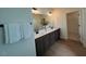 Modern bathroom featuring double vanity sinks, stylish mirrors, and contemporary finishes, providing comfort and style at 235 Chestnut Oak Ln, Lillington, NC 27546
