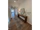 Welcoming entryway features hardwood floors, decorative console table, and stylish mirror, creating an inviting ambiance at 235 Chestnut Oak Ln, Lillington, NC 27546