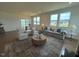 Spacious living area with ample seating, large windows, and stylish decor, ideal for relaxing and entertaining at 235 Chestnut Oak Ln, Lillington, NC 27546