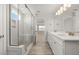 Luxurious bathroom featuring double sink vanity and glass shower at 103 W Star Foal Ln, Wendell, NC 27591