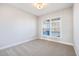 Bright bedroom with neutral walls, carpeted floor and window with natural light at 103 W Star Foal Ln, Wendell, NC 27591