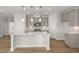 New kitchen featuring a large center island, stainless appliances, and shaker cabinets at 103 W Star Foal Ln, Wendell, NC 27591