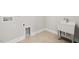 Laundry room with utility sink and neutral walls and tile flooring at 103 W Star Foal Ln, Wendell, NC 27591