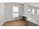 Bright office features built-in desk, window with blinds, and wood-look flooring at 103 W Star Foal Ln, Wendell, NC 27591