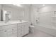 Bathroom featuring a double vanity and a shower-tub combination at 22 Belmont Stakes Ln, Wendell, NC 27591