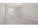 Bedroom featuring neutral carpet and natural light from a window at 22 Belmont Stakes Ln, Wendell, NC 27591
