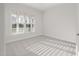 Carpeted bedroom with natural light from a window with blinds at 22 Belmont Stakes Ln, Wendell, NC 27591