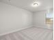 Cozy bedroom with neutral carpet and natural light from a window at 22 Belmont Stakes Ln, Wendell, NC 27591