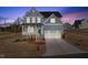 Charming two-story home with a covered porch and attached two-car garage at 22 Belmont Stakes Ln, Wendell, NC 27591