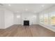 Bright, open living space with a fireplace and large windows at 22 Belmont Stakes Ln, Wendell, NC 27591