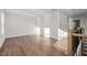 Spacious living room featuring hardwood floors and natural light from the windows at 22 Belmont Stakes Ln, Wendell, NC 27591