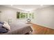 Bright bedroom with hardwood floors and ample natural light at 4416 Arrowhead Trl, Hillsborough, NC 27278