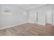 Bright bedroom with wood floors, neutral paint, and natural light at 75 E Star Foal Ln, Wendell, NC 27591