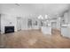 Expansive living space with a cozy fireplace, hardwood floors, and an open layout leading to the kitchen at 75 E Star Foal Ln, Wendell, NC 27591