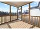 A screened-in back porch offering views of wooded backyard with a wooden deck and serene outdoor space at 75 E Star Foal Ln, Wendell, NC 27591