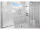 A glass-enclosed shower with white tile and a built-in bench at 75 E Star Foal Ln, Wendell, NC 27591