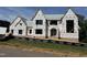 View of construction site of home with exterior weather barrier covering the unfinished facade at 9105 Overlook Crest Dr, Wake Forest, NC 27587