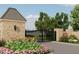 View of the Grand Highlands Estates entry gates showcasing stone pillars and surrounding landscaping at 9105 Overlook Crest Dr, Wake Forest, NC 27587