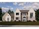 New two-story home featuring mixed material facade with stone accents, complementary windows and an arched front entry at 9105 Overlook Crest Dr, Wake Forest, NC 27587
