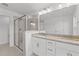 Bright bathroom with walk-in shower, double vanity, and granite countertop at 953 Alma Railway Dr, Wake Forest, NC 27587