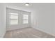 Bright bedroom features neutral carpet, natural light, and minimalist decor at 953 Alma Railway Dr, Wake Forest, NC 27587