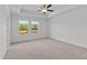 Bright bedroom features neutral carpet, natural light, and ceiling fan at 953 Alma Railway Dr, Wake Forest, NC 27587