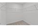 Walk-in closet with wire shelving and neutral carpet at 953 Alma Railway Dr, Wake Forest, NC 27587