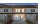 Townhomes with garages, showing the well maintained exteriors and lawns at 953 Alma Railway Dr, Wake Forest, NC 27587