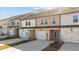 Newly built townhomes with private garages and driveways and manicured lawns at 953 Alma Railway Dr, Wake Forest, NC 27587