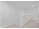 Hallway with neutral carpet, white walls, and natural lighting at 953 Alma Railway Dr, Wake Forest, NC 27587