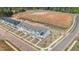 Aerial view of newly constructed townhomes with modern design in a Primary-planned community at 959 Alma Railway Dr, Wake Forest, NC 27587