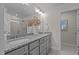 Modern bathroom featuring a dual sink vanity with granite countertops and contemporary lighting at 959 Alma Railway Dr, Wake Forest, NC 27587