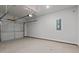 Spacious two-car garage features a gray door, neutral walls, and ample room for storage at 959 Alma Railway Dr, Wake Forest, NC 27587