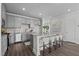Bright kitchen features an island with bar seating and ample counter space at 959 Alma Railway Dr, Wake Forest, NC 27587