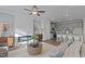Bright living room featuring a modern fireplace, open floor plan, and a stylishly appointed kitchen area at 959 Alma Railway Dr, Wake Forest, NC 27587