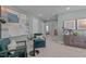Inviting sitting room features stylish furnishings, elegant artwork, and ample natural light from nearby windows at 959 Alma Railway Dr, Wake Forest, NC 27587