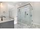 Bathroom features a glass-enclosed shower with white subway tiles and gray-veined marble floors at 649 Riverwood Dr, Clayton, NC 27527
