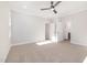 Spacious bedroom with carpet, ceiling fan, and access to ensuite bathroom and closet at 649 Riverwood Dr, Clayton, NC 27527