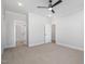 Bedroom with plush carpet, ceiling fan, and doorways to adjacent rooms at 649 Riverwood Dr, Clayton, NC 27527